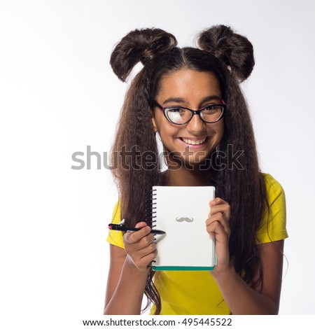 Emotional young brunette girl with long hair in yellow t-shirt with the glasses on a white background