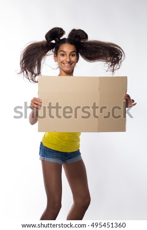 Emotional young brunette girl with long hair in yellow t-shirt with beige cardboard sheet for records on a white background