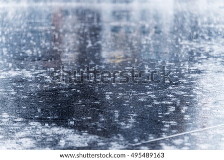 close up rain water drop falling in city street floor with the water, vintage style picture