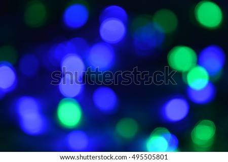 Christmas lights defocused. Blur dots. Happy new year abstract multicolored background. Illuminated decoration. Dream theme.