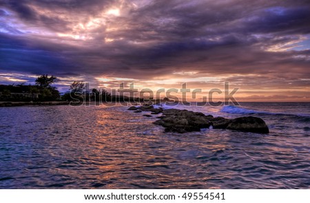 Jamaican Sunset and rocks Royalty-Free Stock Photo #49554541