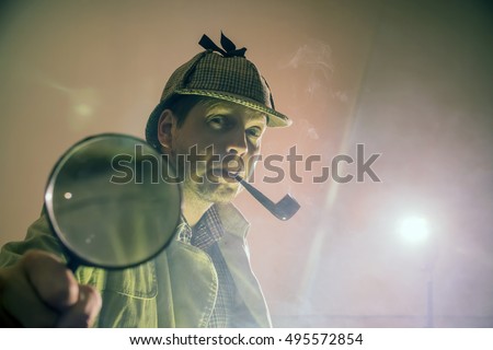 sherlock holmes in studio etective at work with magnifying glass and pipe
 Royalty-Free Stock Photo #495572854