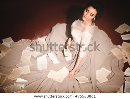 Beautiful luxury bride with book pages