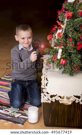 Young Boy in front of Christmas tree