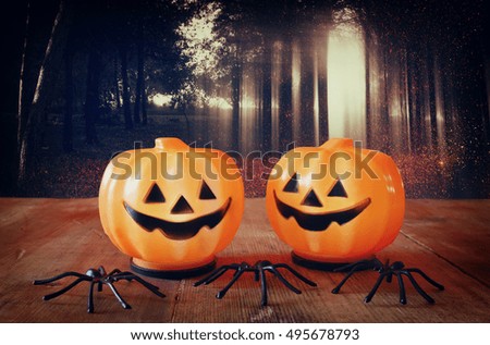 Halloween holiday concept. Cute pumpkins on wooden table