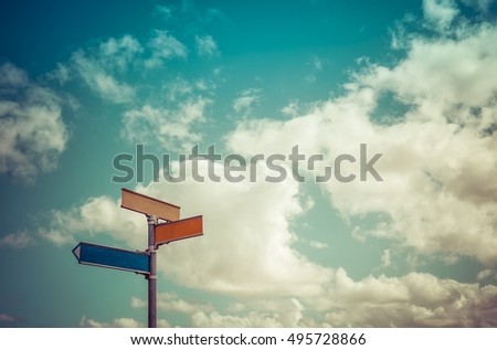 Signpost on a cloudy background - Vintage filter
