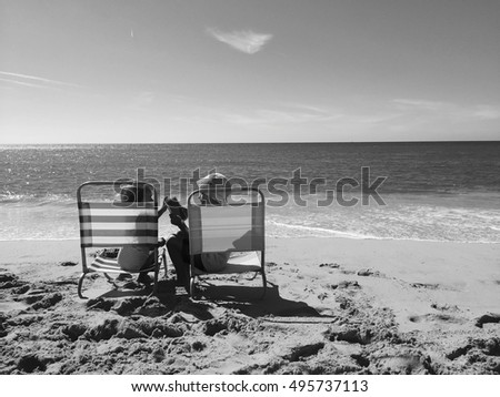 Children using white tablet pc on sunny beach outdoors background. Mobile photography design idea 