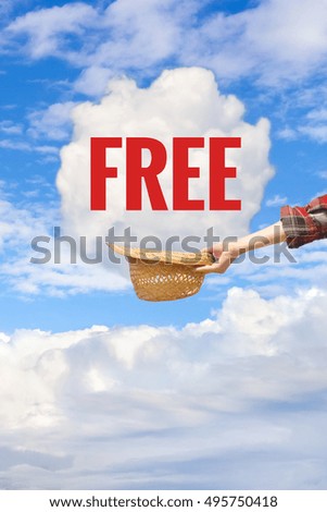  Free concept. Cloud and hand holding hat on blue sky background. Banner or Card