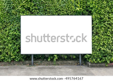 White billboard mockup on spring summer green leaves background.