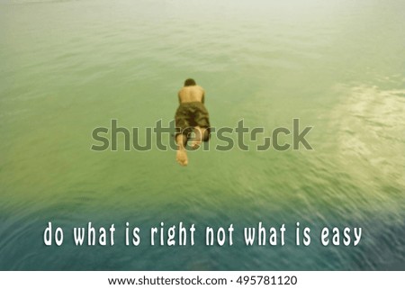 Inspirational quote on blurred background with a man dive into sea.