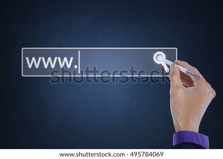 Concept of searching system and internet. Hand pressing a virtual search button with a stylus pen on the virtual screen