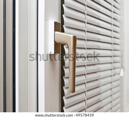 Aluminium blinds on the plastik window Royalty-Free Stock Photo #49578439