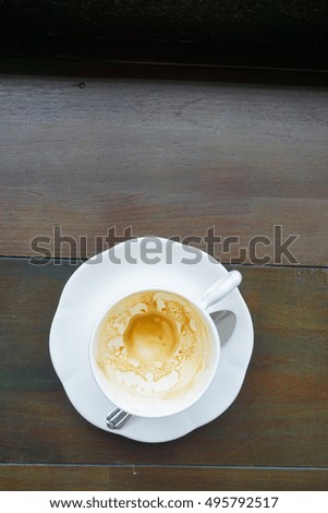 Empty coffee cup after drink on wood table
