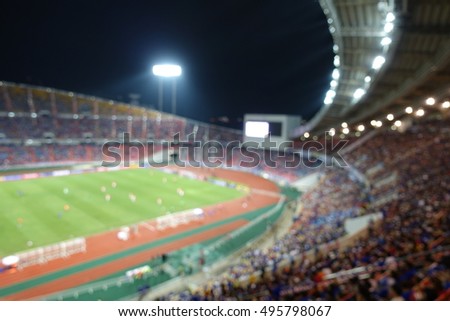 View of international football match in large stadium . Blurred picture