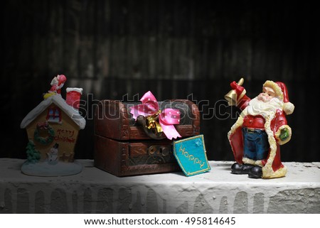 Fairy Santa Claus brought gifts for Christmas at the house with wooden treasure chest, decoration in night time, still life style