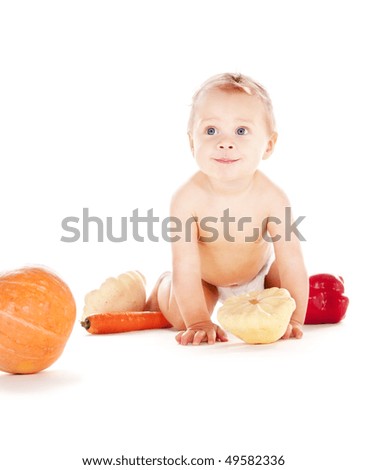 picture of baby boy in diaper with vegetables