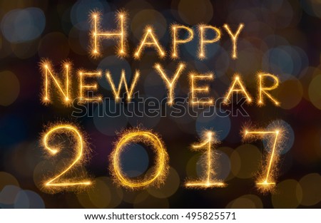 Happy new year 2017 written with Sparkle firework on black background, celebration and greeting cards concept
