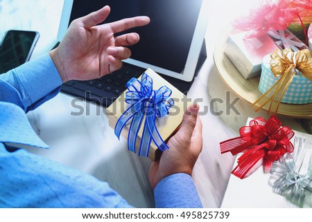 medical doctor hand with credit card with gift with laptop computer and smart phone on mable desk,filter film effect