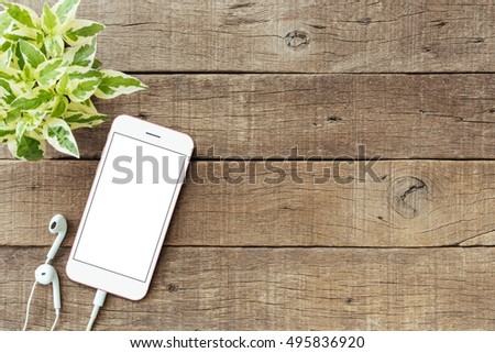 phone blank white screen on old wood table, mockup phone rose gold color