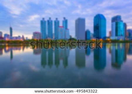 Blur City building with water reflection before sunset background