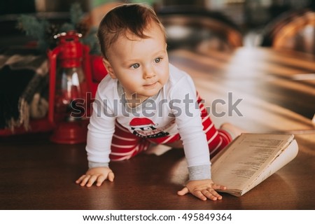 Book examines a little boy sitting on the floor, before the new year
