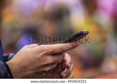 people is holding mobile background is colorful