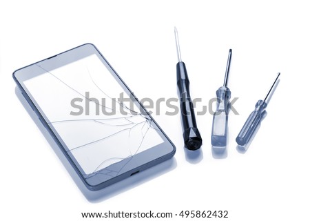 Broken screen on smartphone and tools for fixing, closeup on white background
