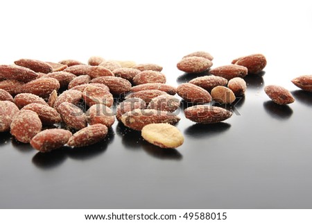 Salty almonds scattered across a table