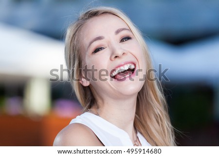 close up portrait of laughing business woman with blurred background