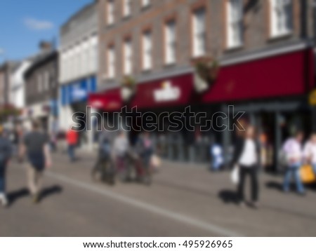 Blurred background of shops and shoppers