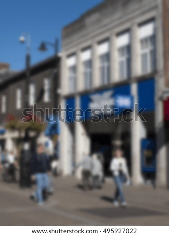 Blurred background of shops and shoppers