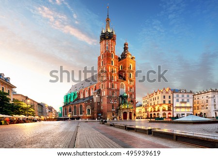 Old city center view with Adam Mickiewicz monument and St. Mary's Basilica in Krakow Royalty-Free Stock Photo #495939619