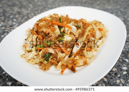 Thai style fried noodles :Pad Thai,fried noodles with vegetables on white plate.