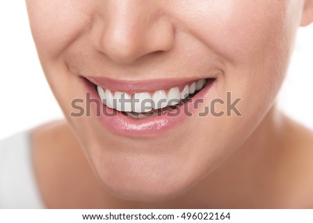 Beautiful wide smile of young woman. Closeup photo.