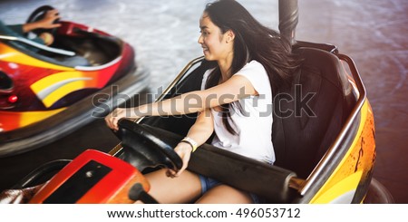 Girl Driving Bumper Car Happiness Enjoyment Concept Royalty-Free Stock Photo #496053712