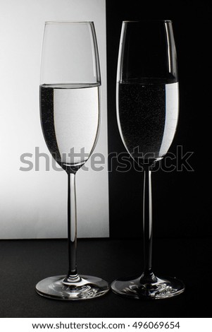 two glasses on the black and white