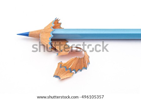 Blue color pencil has been sharpened, with pencil shavings on white background