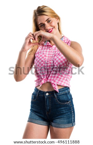 Girl making a heart with her hands