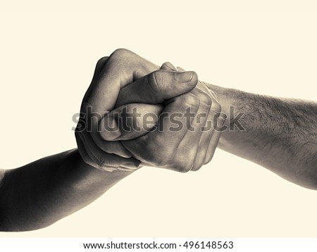 Struggle between the two rivals (arm wrestling). Image is black and white, toned, isolated.