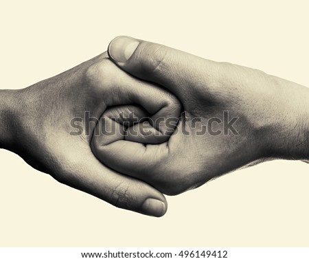 Male and female hands connected with each other  together and forever. This black and white Image is toned and isolated for easy  transfer in your design. Royalty-Free Stock Photo #496149412