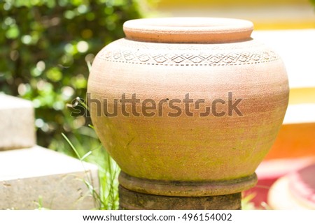 earthen jar in the garden,earthen water jar,garden props,