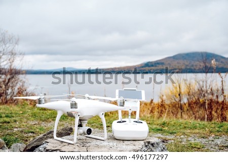  Drone quadrocopter and remote control with high resolution digital camera. New tool for aerial photo and video.