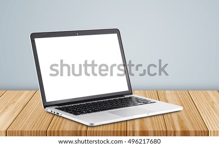 Front view of the laptop is on the work table, clipping path inside