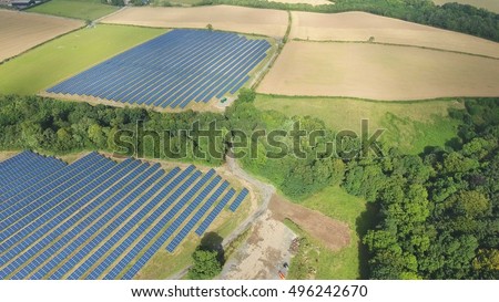 Aerial industrial view Photovoltaic solar panels on a Renewable Energy Solar plant in the Countryside