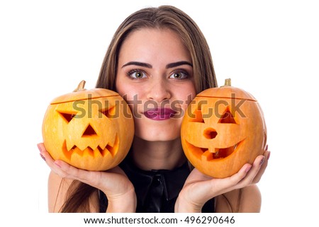 Woman holding two pumpkins 