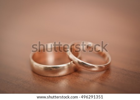 two wedding rings on the table
