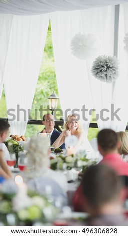 beautiful couple sitting together at a table in a restaurant