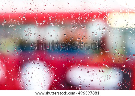 Raindrops on double decker bus, London