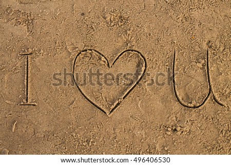 I Love U sign on the wet sand beach