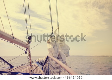 Vintage picture of beautiful sail boat details. Rope, hull, rigging sailing yacht background